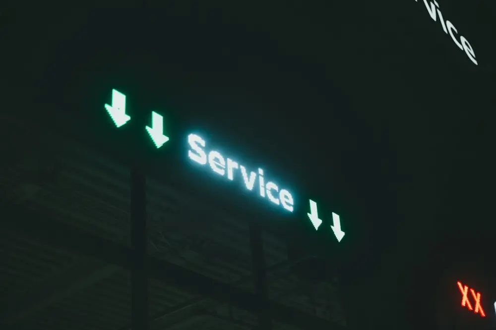 A lit up sign that says service i and x, illustrating civil service continuity